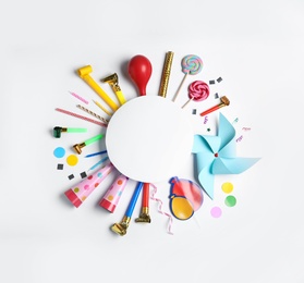 Composition with birthday party items and empty card on white background, top view. Space for design