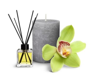 Image of Beautiful composition with reed diffuser, candle and orchid flower on white background. Spa therapy