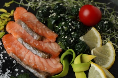 Photo of Tasty freshly cooked salmon with spinach, closeup