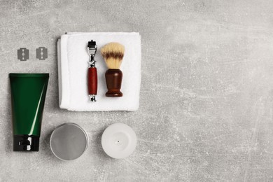 Set of men's shaving tools on light gray table, flat lay. Space for text