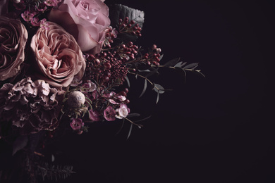 Photo of Beautiful bouquet on black background, space for text. Floral card design with dark vintage effect