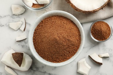 Photo of Flat lay composition with natural coconut sugar on white marble table