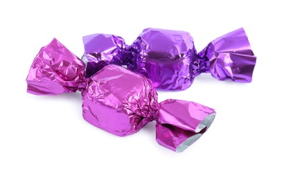 Photo of Two candies in colorful wrappers isolated on white