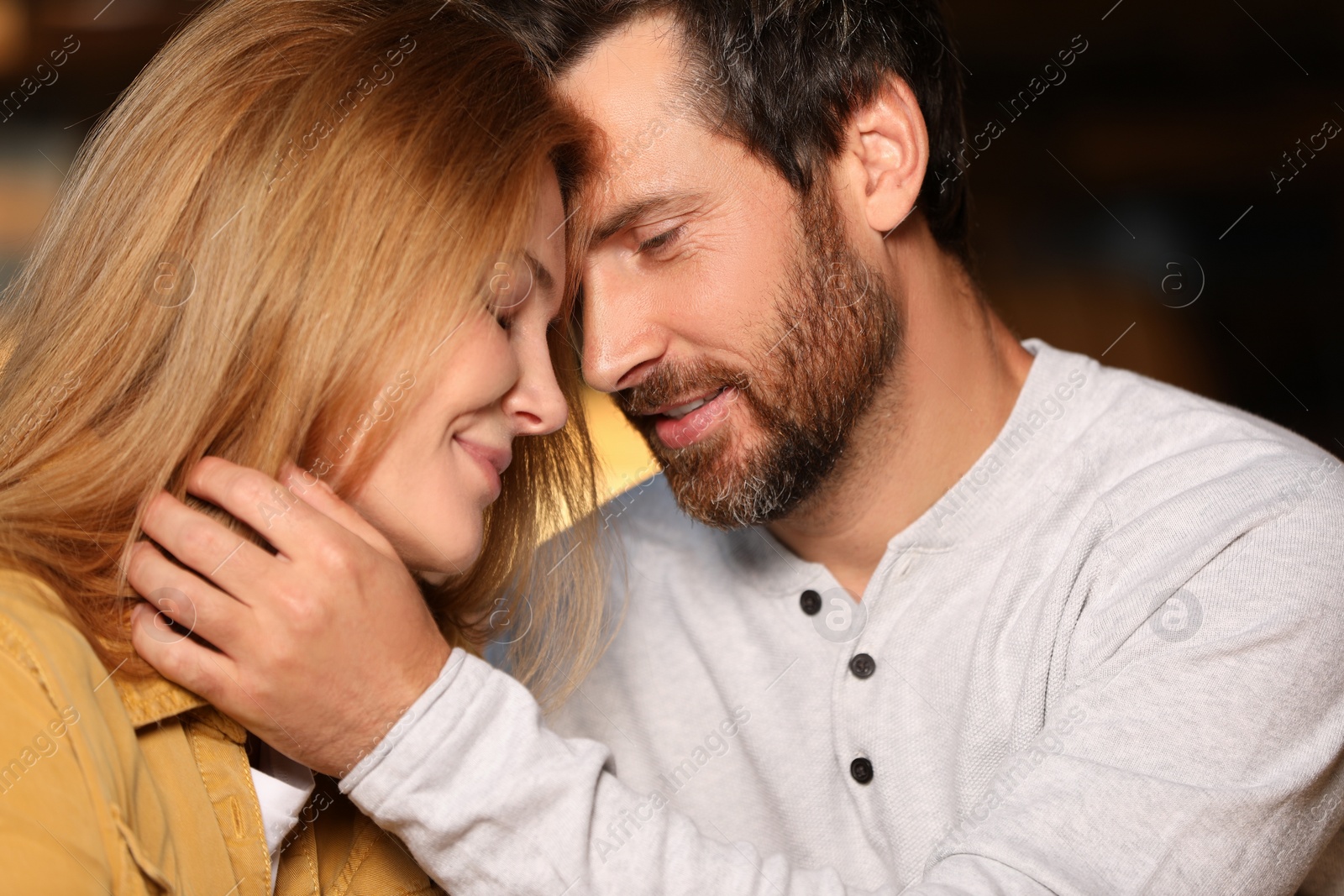 Photo of Romantic date. Lovely couple spending time together on blurred background