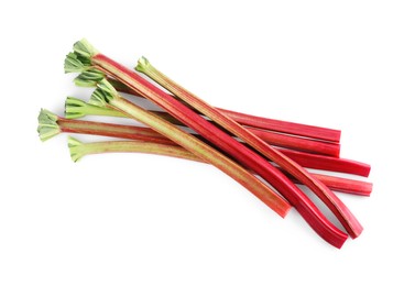 Photo of Fresh rhubarb stalks isolated on white, top view