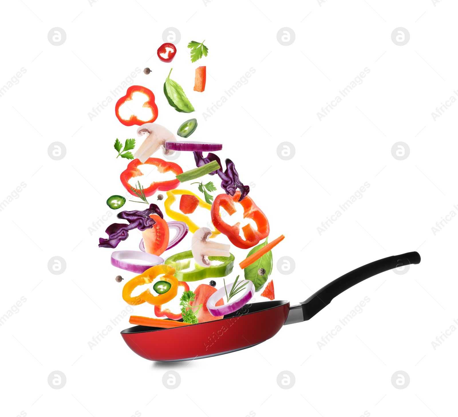 Image of Different vegetables falling into frying pan on white background. Process of cooking