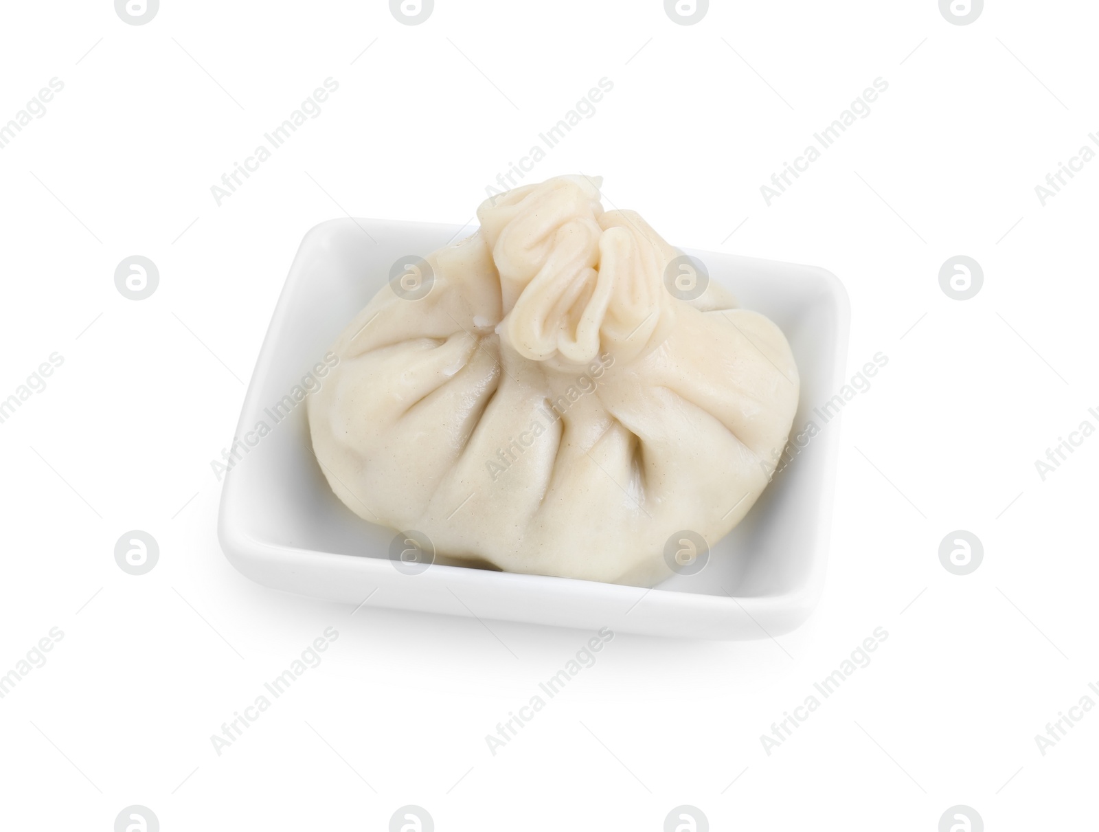 Photo of One tasty khinkali (dumpling) in bowl isolated on white. Georgian cuisine