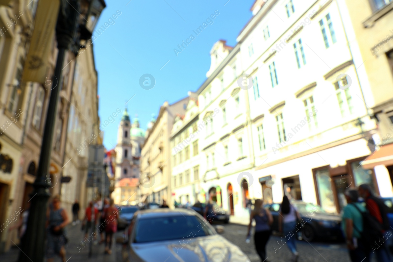 Photo of PRAGUE, CZECH REPUBLIC - APRIL 25, 2019: Blurred view of city street with old buildings