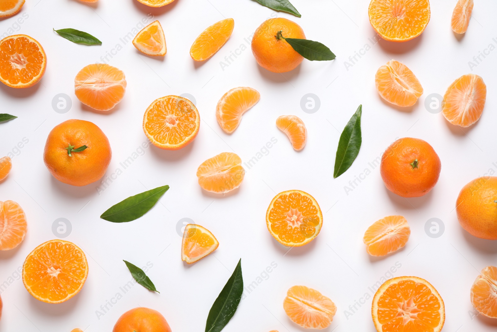 Photo of Composition with fresh ripe tangerines and leaves on white background, flat lay. Citrus fruit