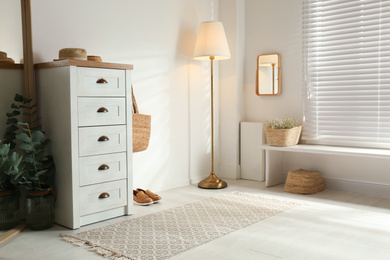 Photo of Chest of drawers in stylish room interior