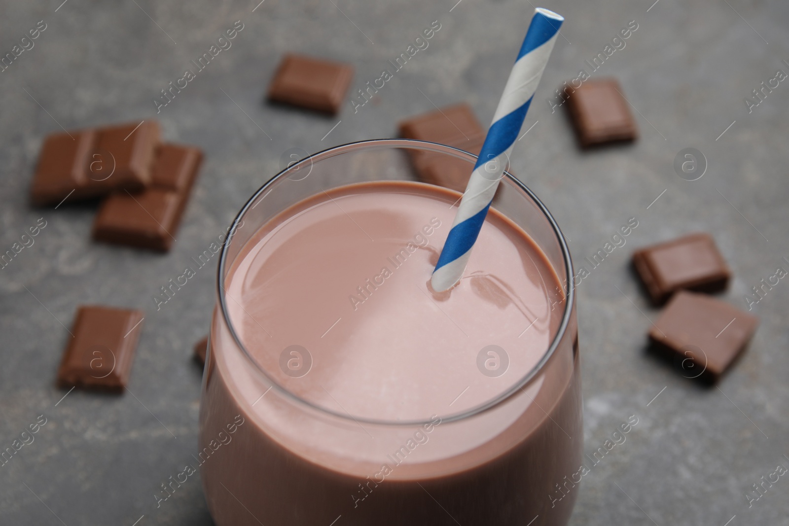 Photo of Delicious chocolate milk in glass, closeup view