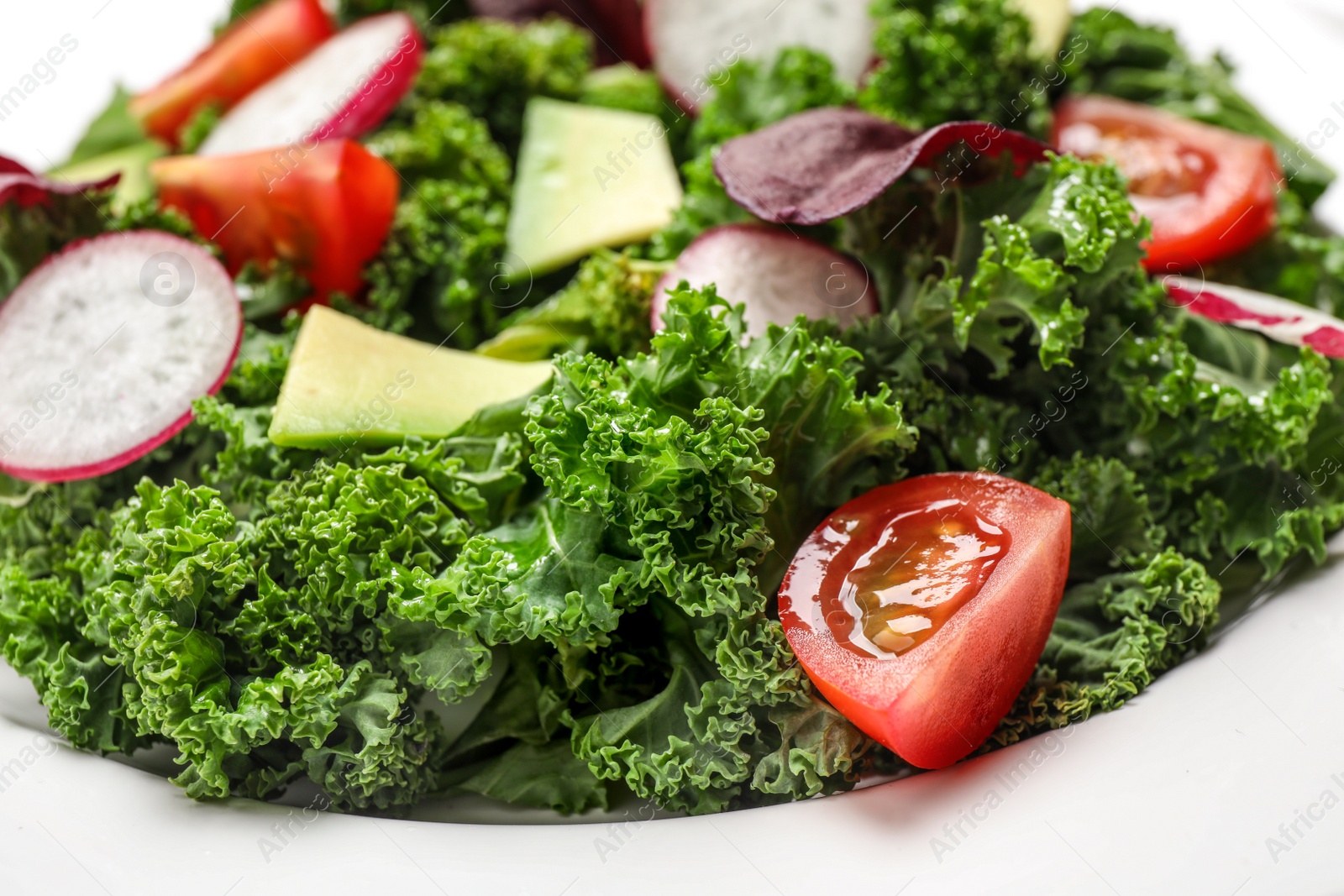 Photo of Plate with delicious salad with kale leaves, closeup