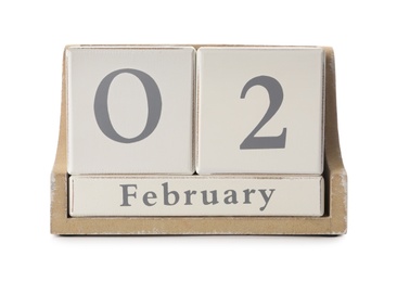Wooden block calendar with date February 2nd on white background. Groundhog day