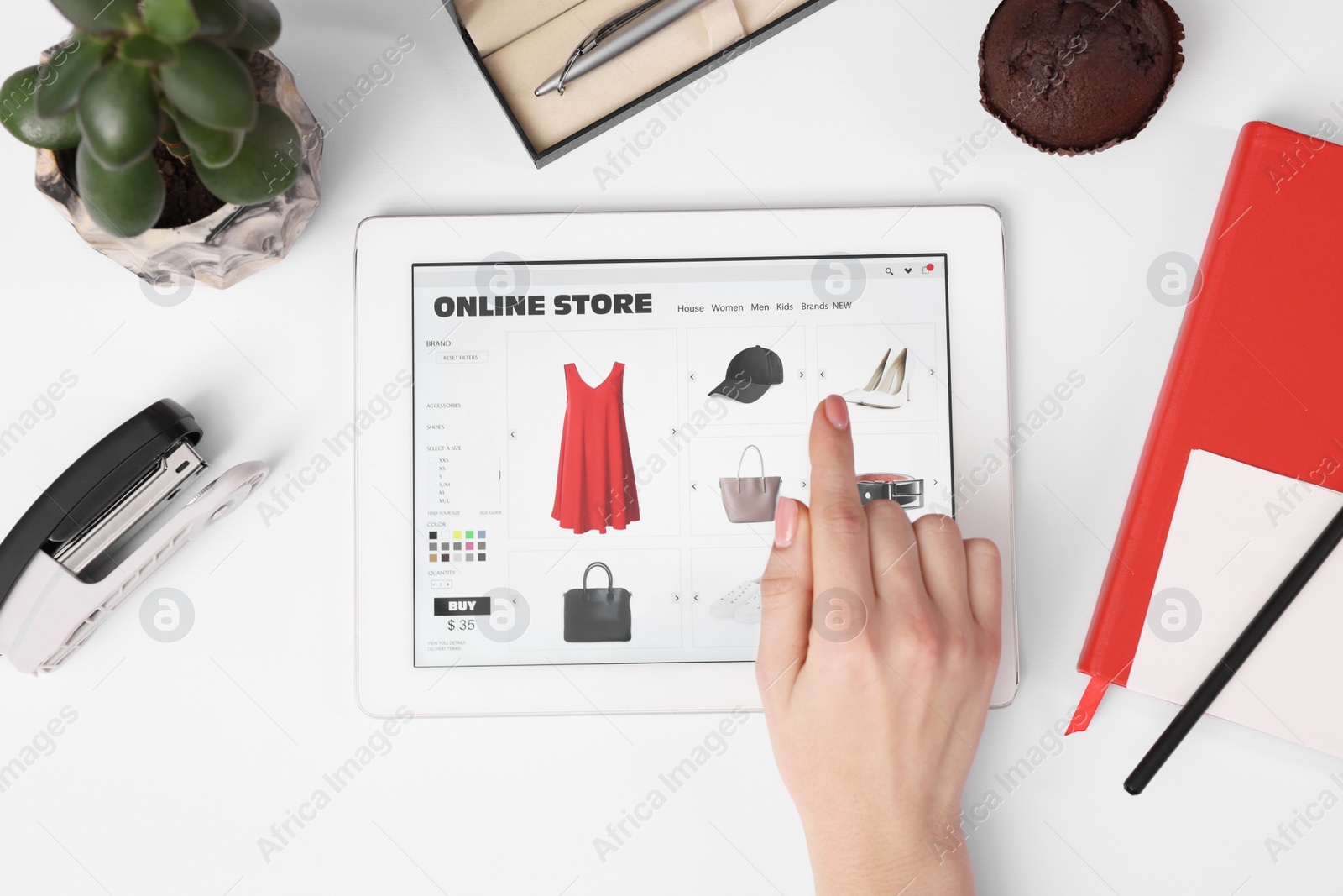 Photo of Woman with tablet shopping online on white background, top view