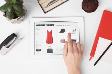 Photo of Woman with tablet shopping online on white background, top view