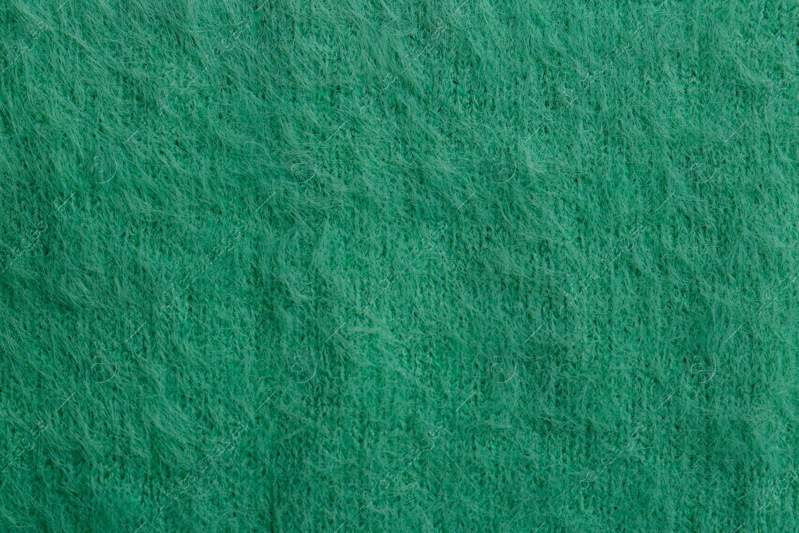 Photo of Beautiful green fabric as background, top view