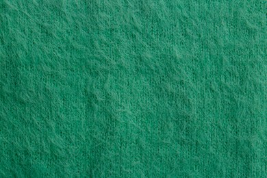 Beautiful green fabric as background, top view