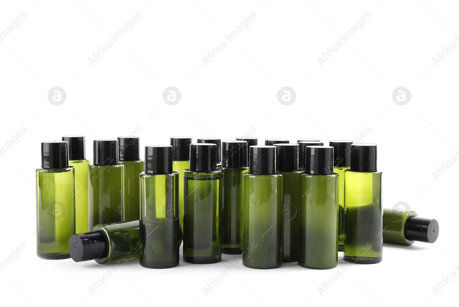 Photo of Mini bottles with cosmetic products on white background