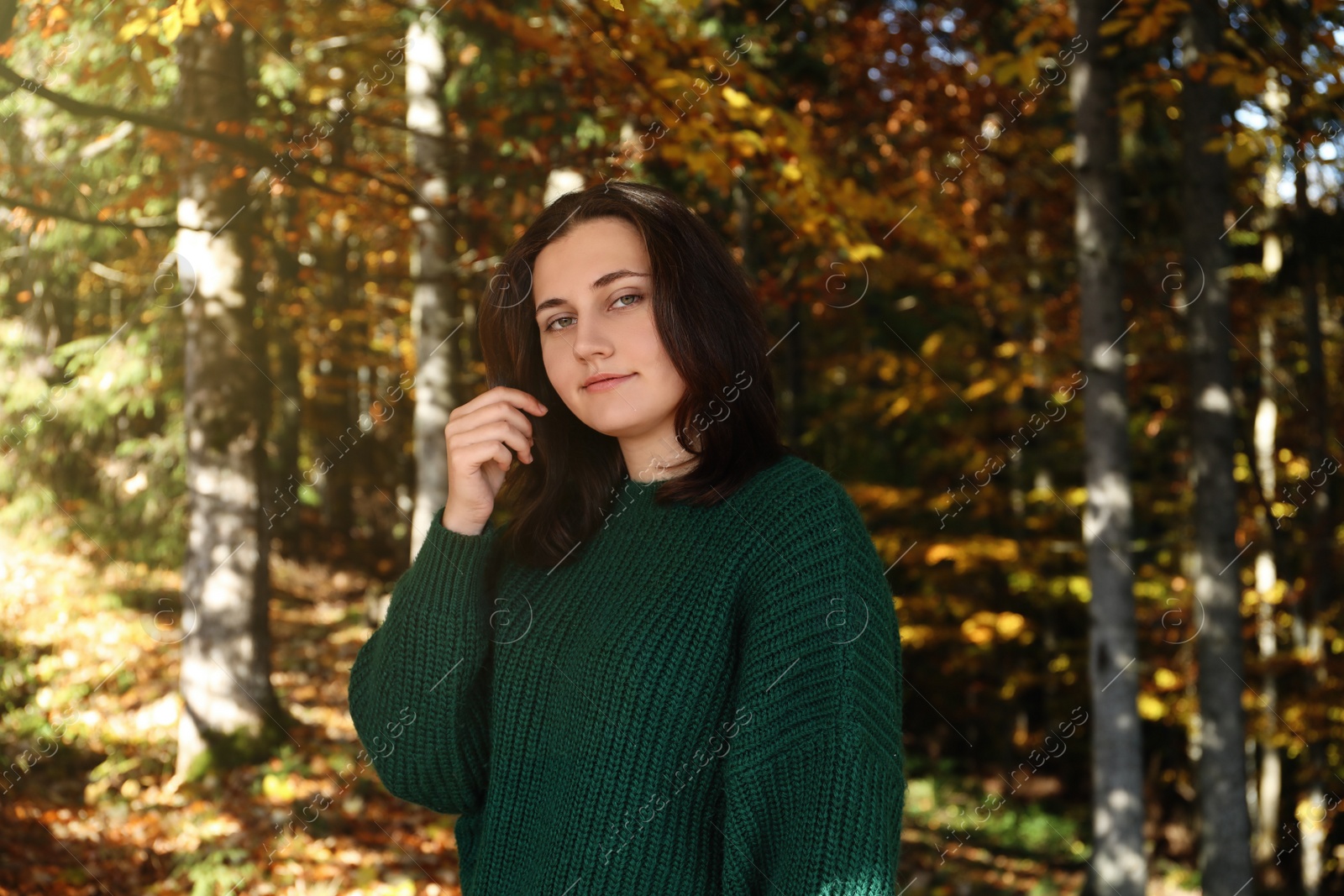 Photo of Portrait of beautiful young woman in autumn forest