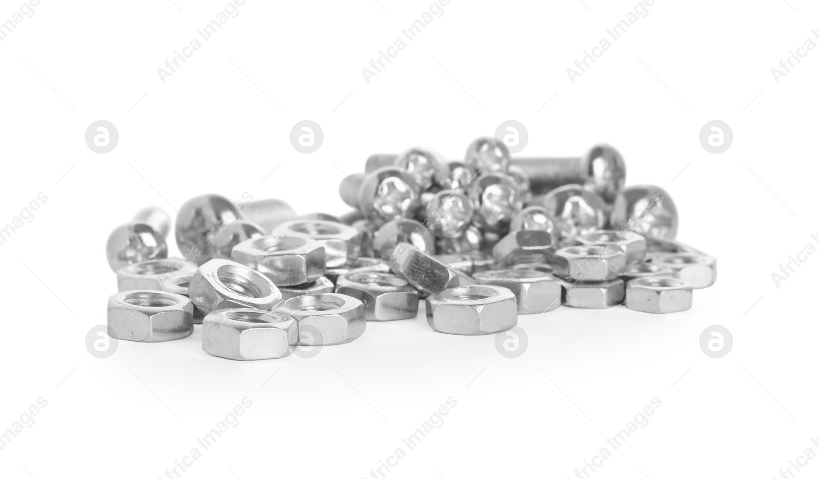 Photo of Many metal bolts and nuts on white background