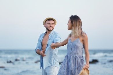 Young couple spending time together on beach