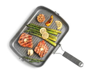 Photo of Frying pan with tasty grilled salmon, lemon and asparagus on white background, top view