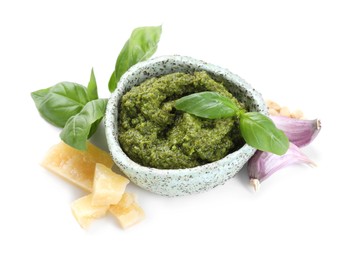 Photo of Fresh tasty pesto sauce and ingredients isolated on white