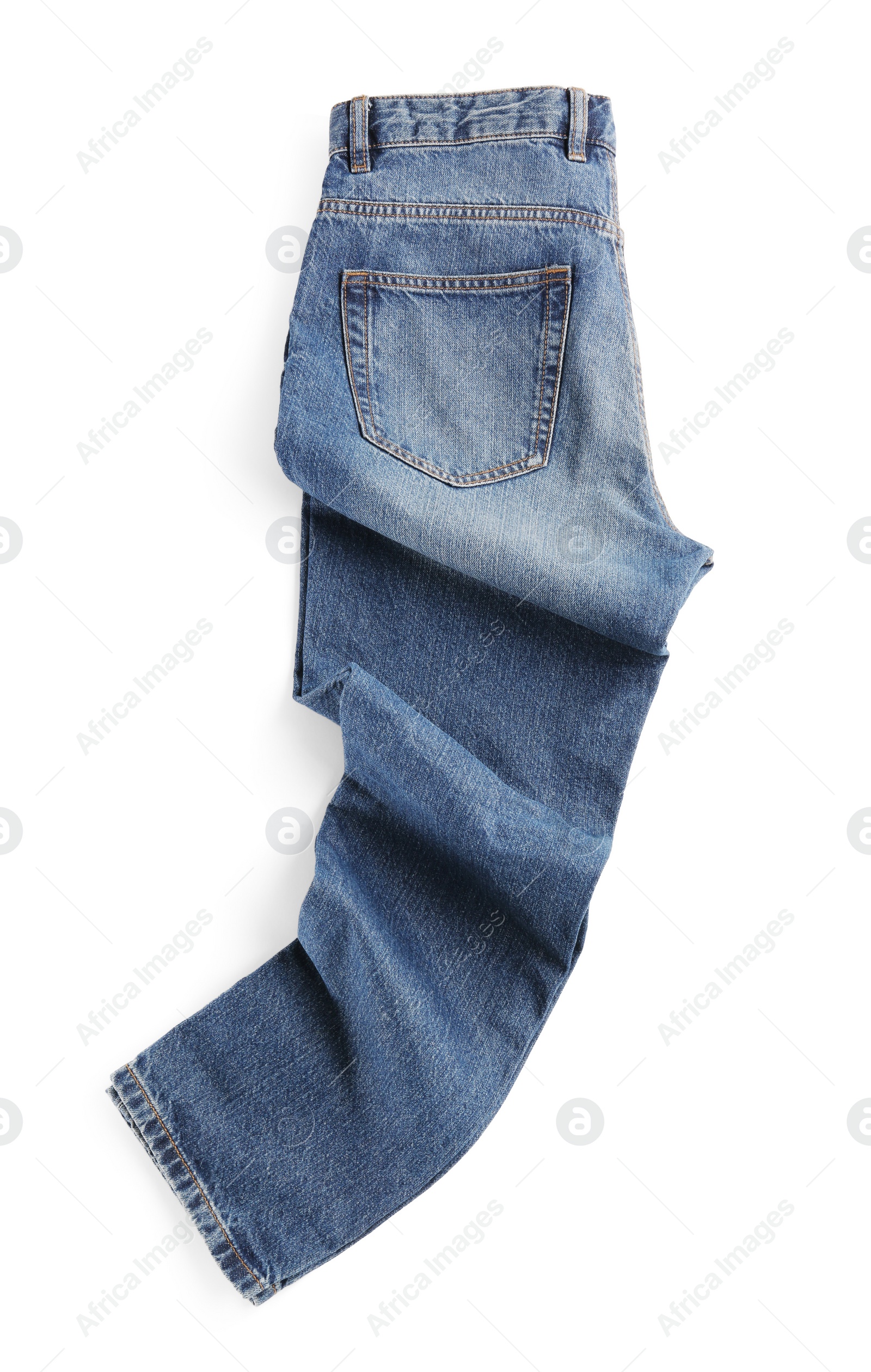 Photo of Rumpled blue jeans isolated on white, top view. Stylish clothes