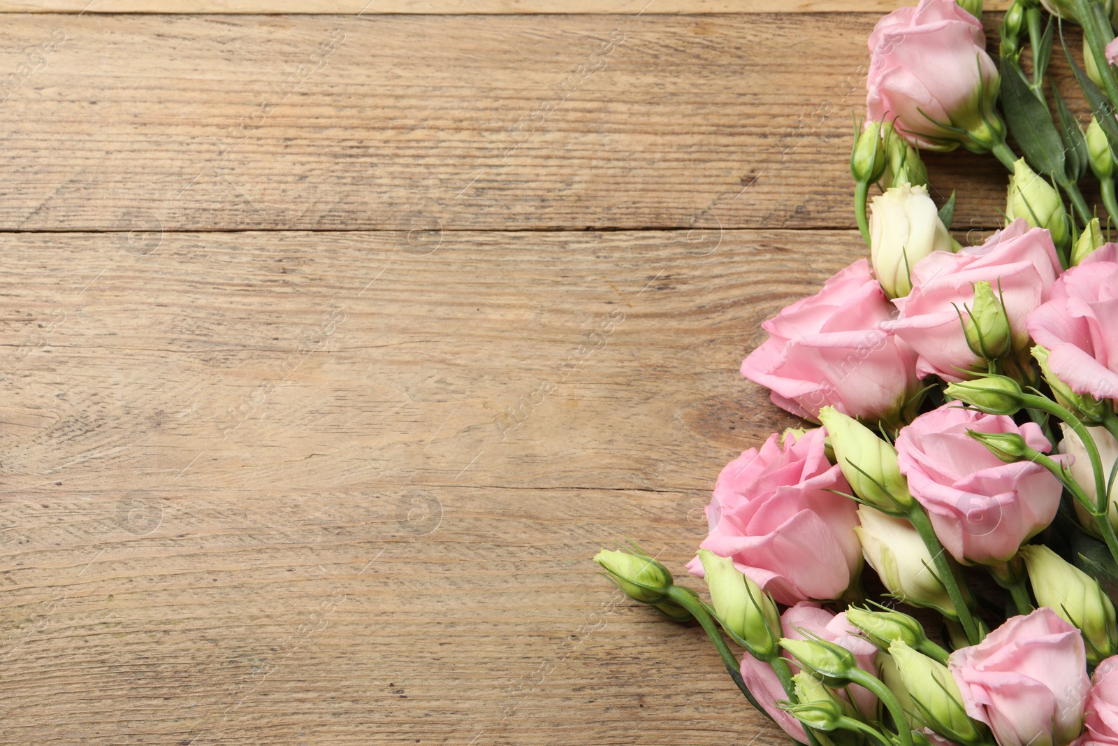 Photo of Happy Mother's Day. Beautiful flowers on wooden table, flat lay. Space for text