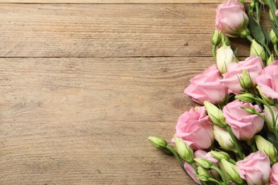 Happy Mother's Day. Beautiful flowers on wooden table, flat lay. Space for text