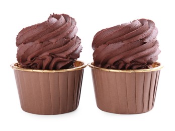 Photo of Two delicious chocolate cupcakes isolated on white