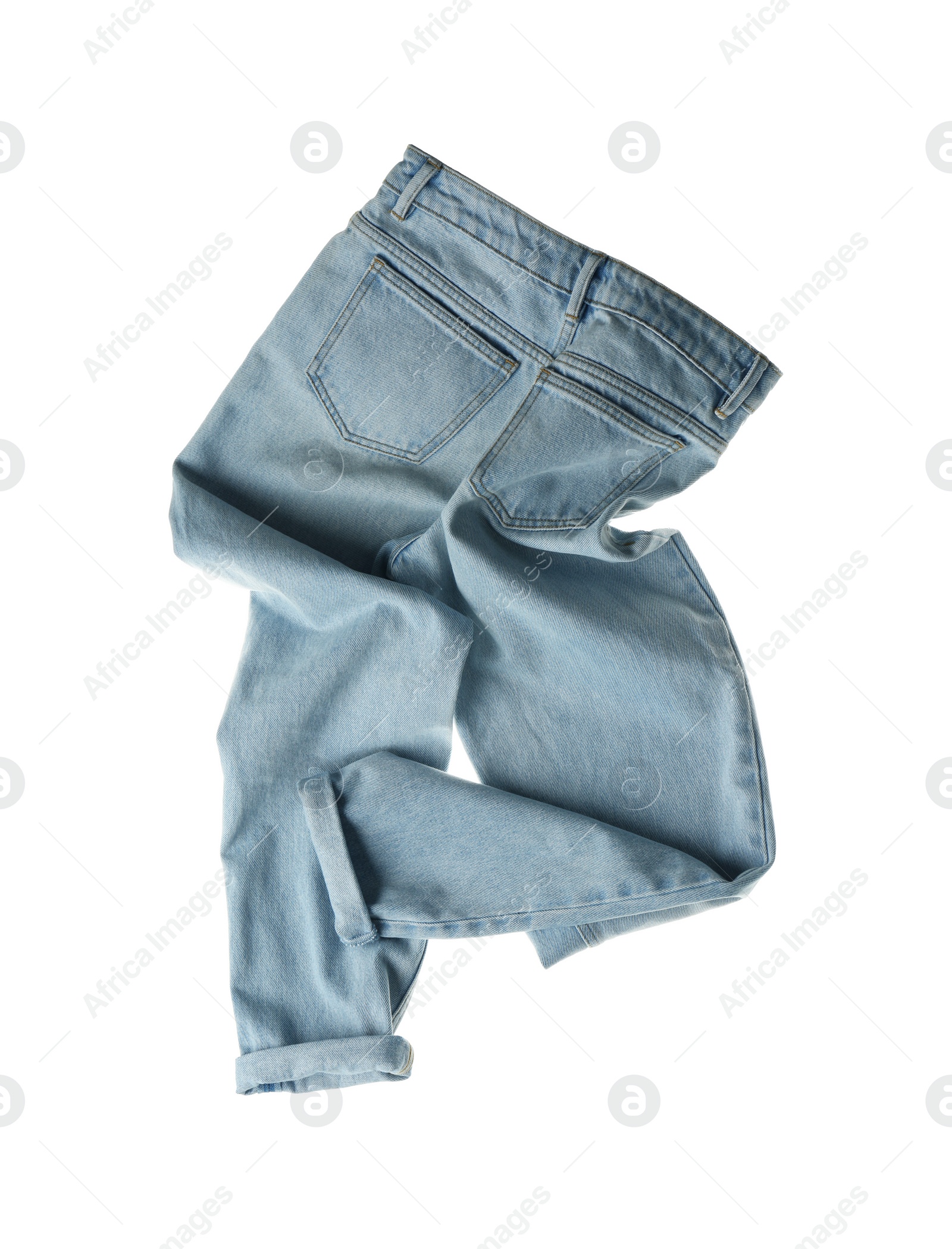 Photo of Rumpled jeans isolated on white. Messy clothes