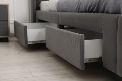 Photo of Storage drawers for bedding under modern bed in room