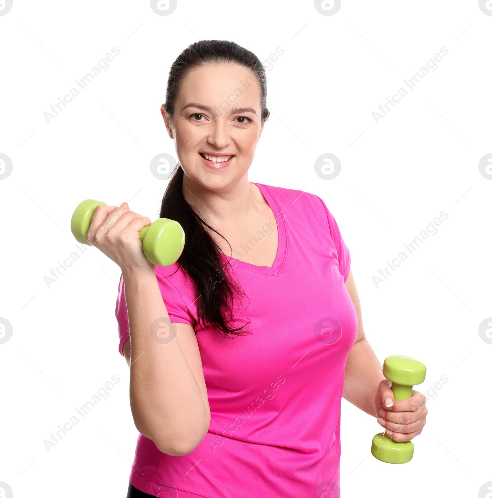 Photo of Happy overweight woman doing exercise with dumbbells on white background