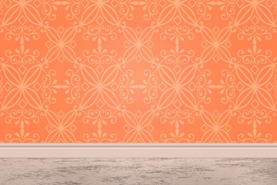 Orange wallpaper with pattern and light grey floor in room