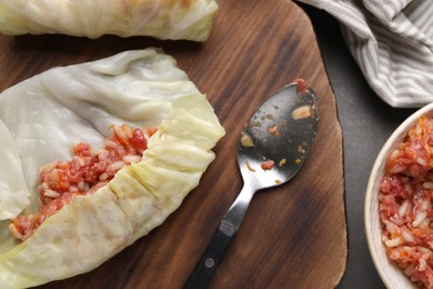 Photo of Preparing stuffed cabbage rolls on grey table, flat lay