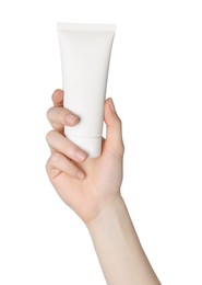 Woman holding tube of face cleansing product on white background, closeup