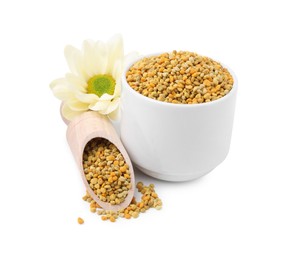 Photo of Fresh bee pollen granules and flower isolated on white