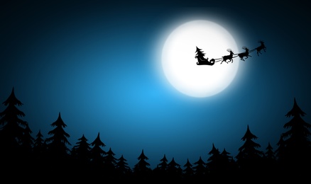 Image of Magic Christmas eve. Reindeers pulling Santa's sleigh in sky on full moon night