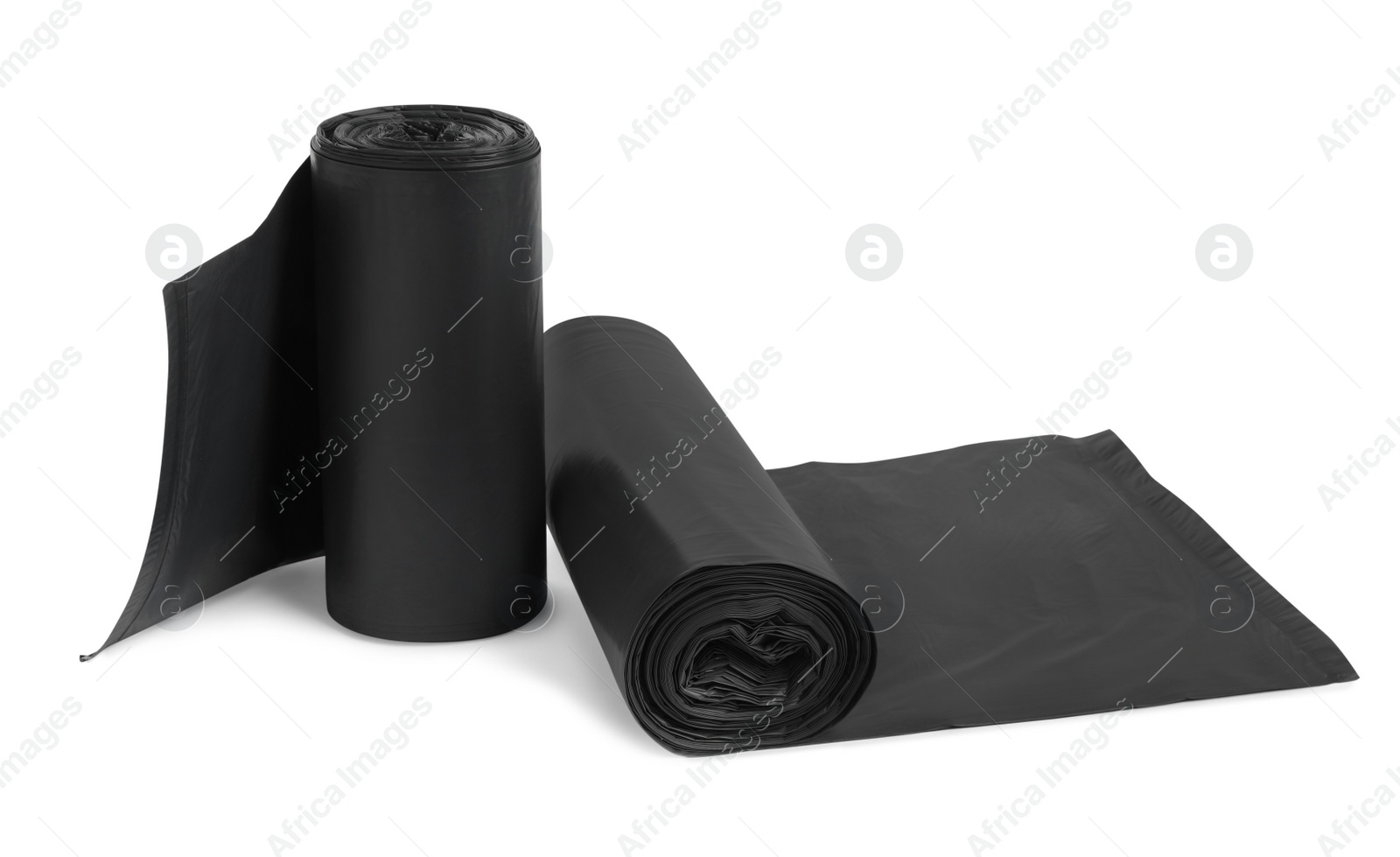 Photo of Rolls of different garbage bags on white background. Cleaning supplies