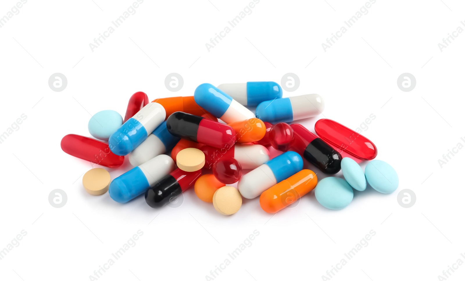 Photo of Heap of different colorful pills isolated on white