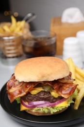 Photo of Tasty burger with bacon, vegetables and patty served with french fries on light grey table, closeup