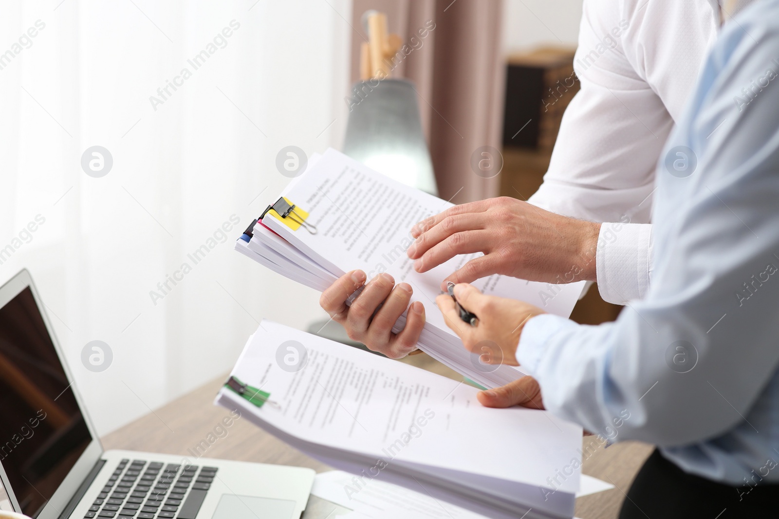 Photo of Businesspeople working with documents in office, closeup