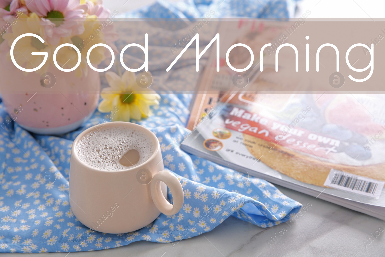 Image of Good morning! Cup of fresh coffee, beautiful bouquet and magazines on light blue printed cloth