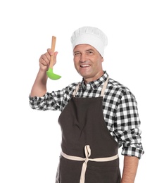 Mature male chef holding ladle on white background