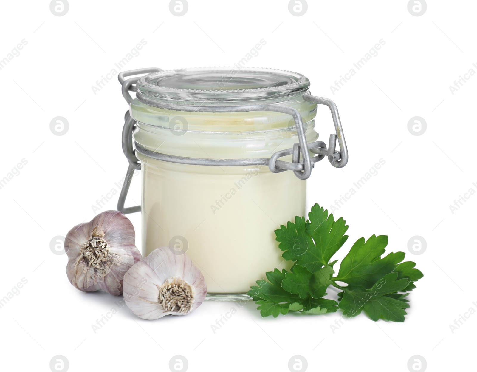 Photo of Fresh mayonnaise sauce in glass jar, garlic and parsley isolated on white