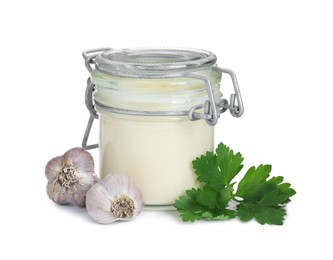 Photo of Fresh mayonnaise sauce in glass jar, garlic and parsley isolated on white