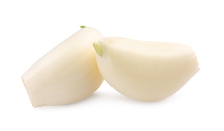 Photo of Peeled cloves of garlic isolated on white