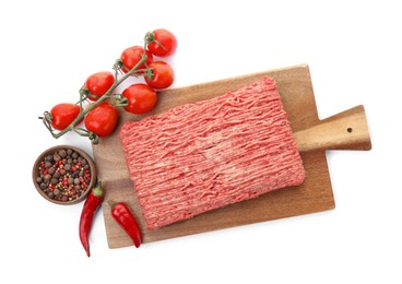 Photo of Wooden board with raw fresh minced meat, tomatoes and other ingredients on white background