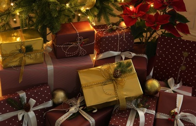 Photo of Many different beautiful gifts under Christmas tree